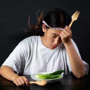 depressed woman hungry from dieting