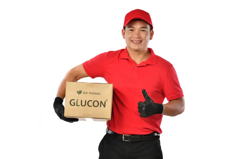 asian delivery man red uniform with parcel cardboard box isolated white 1 (1)