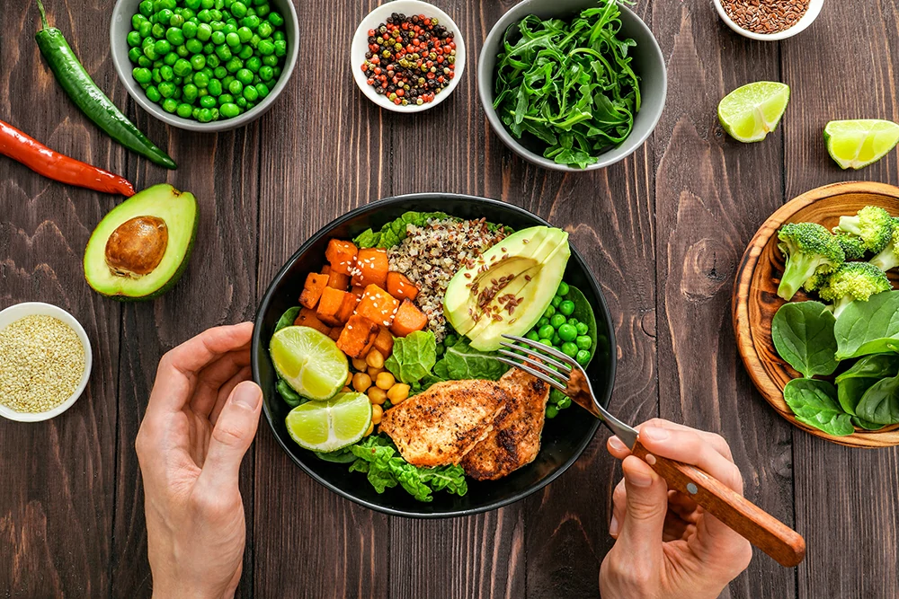 delicious lunch with quinoa avocado sweat potato fried chicken seasoning wooden background top view