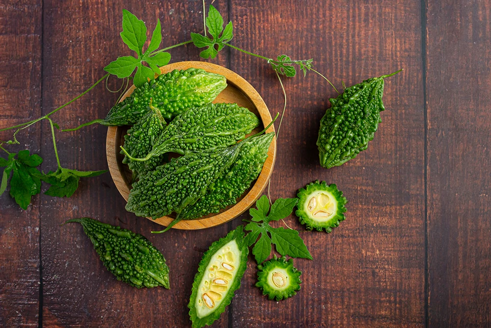 raw bitter gourd put wooden round plate